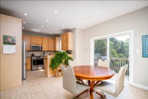 Eat-in kitchen with walk-out to kitchen balcony - Country homes for sale and luxury real estate including horse farms and property in the Caledon and King City areas near Toronto