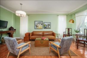 Family room with hardwood floors - Country homes for sale and luxury real estate including horse farms and property in the Caledon and King City areas near Toronto